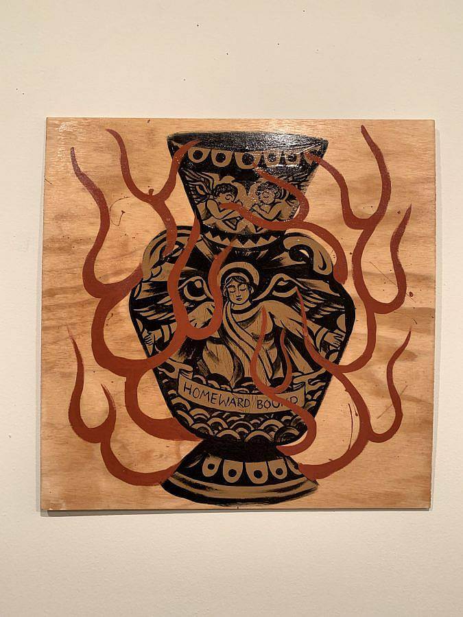 Photo of a woodstain and latex painting on plywood. There is a vase with angels painted on it. A painted banner reads "Homeward Bound," on the bottom of the vase. Red flame line work encircles the vase.